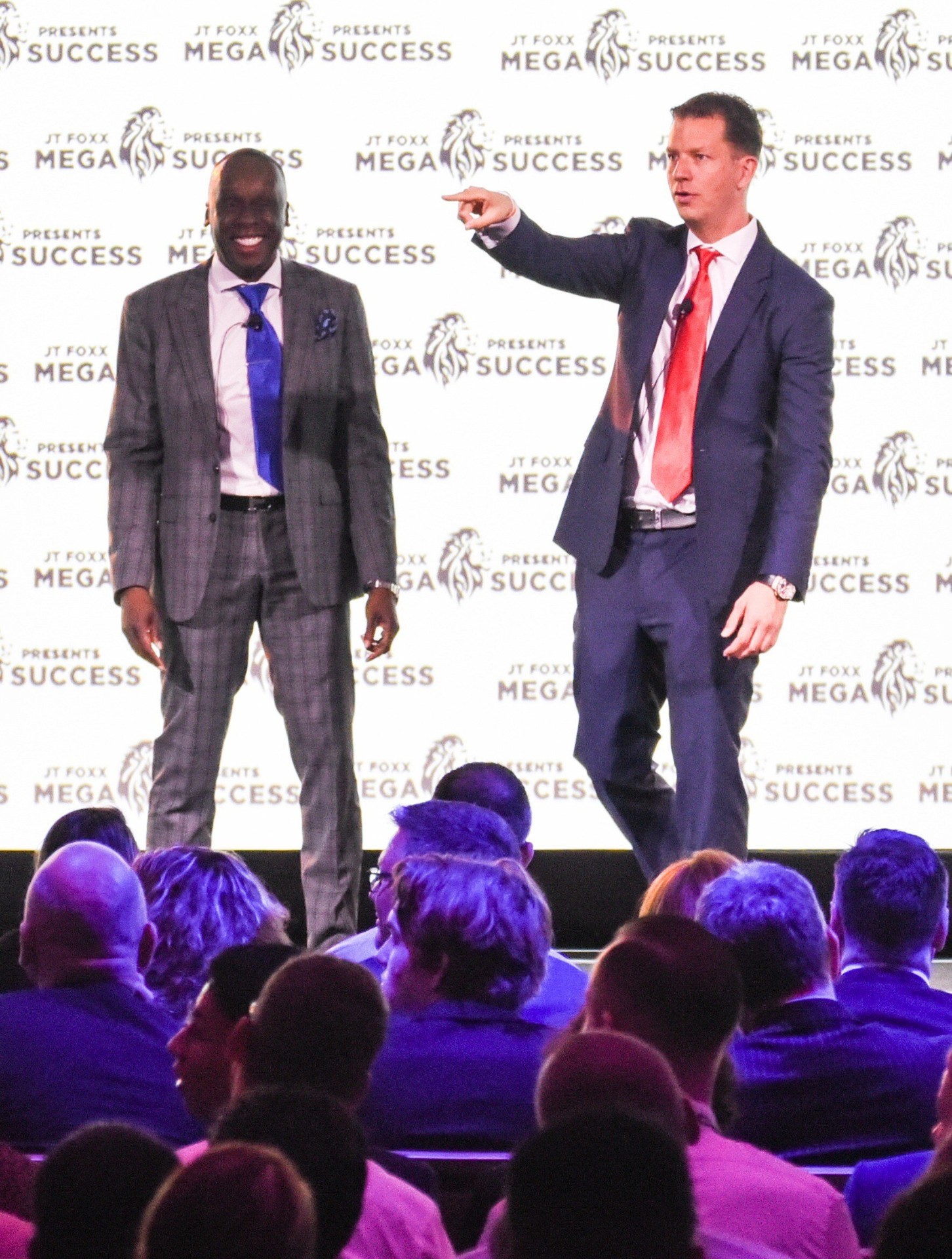 JT Foxx on stage at a Mega Success event